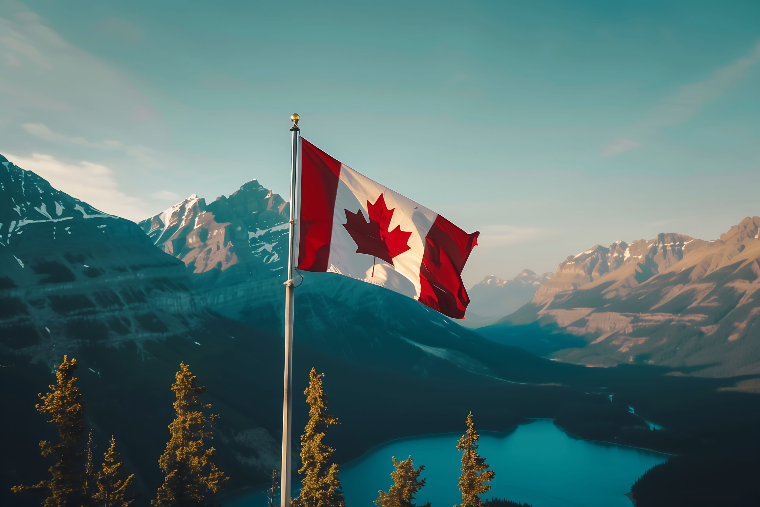 Canadian flag waving with mountains in the background during Canada Day celebration