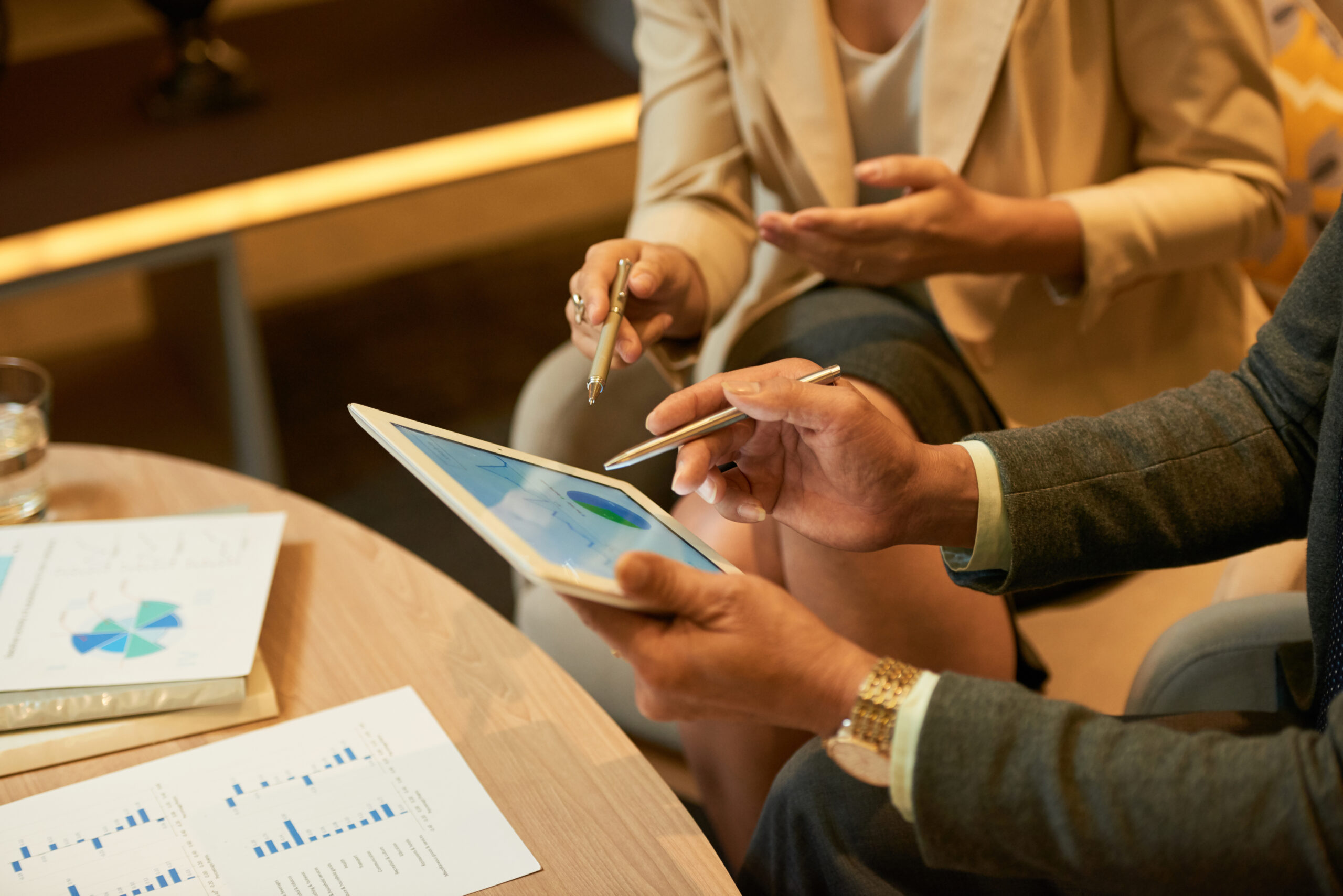 People discussing a financial diagram during a business meeting